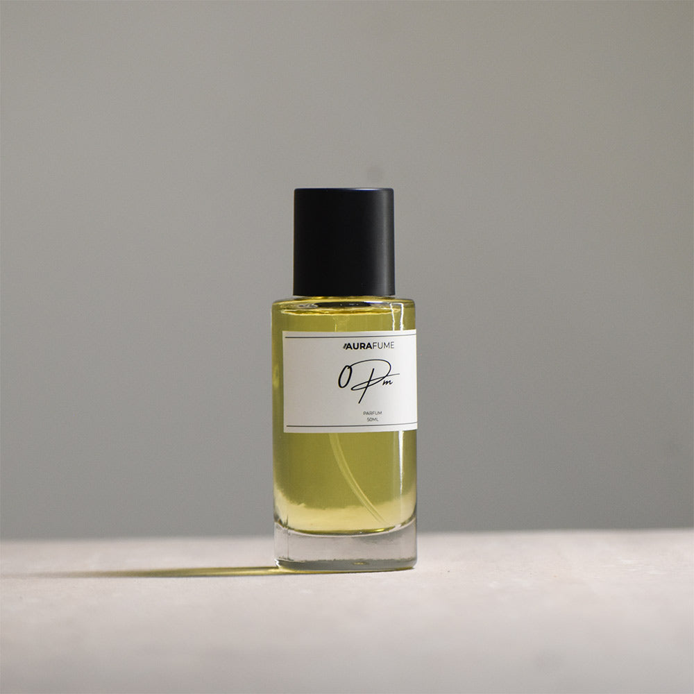 Perfume bottle with a label on a gray background